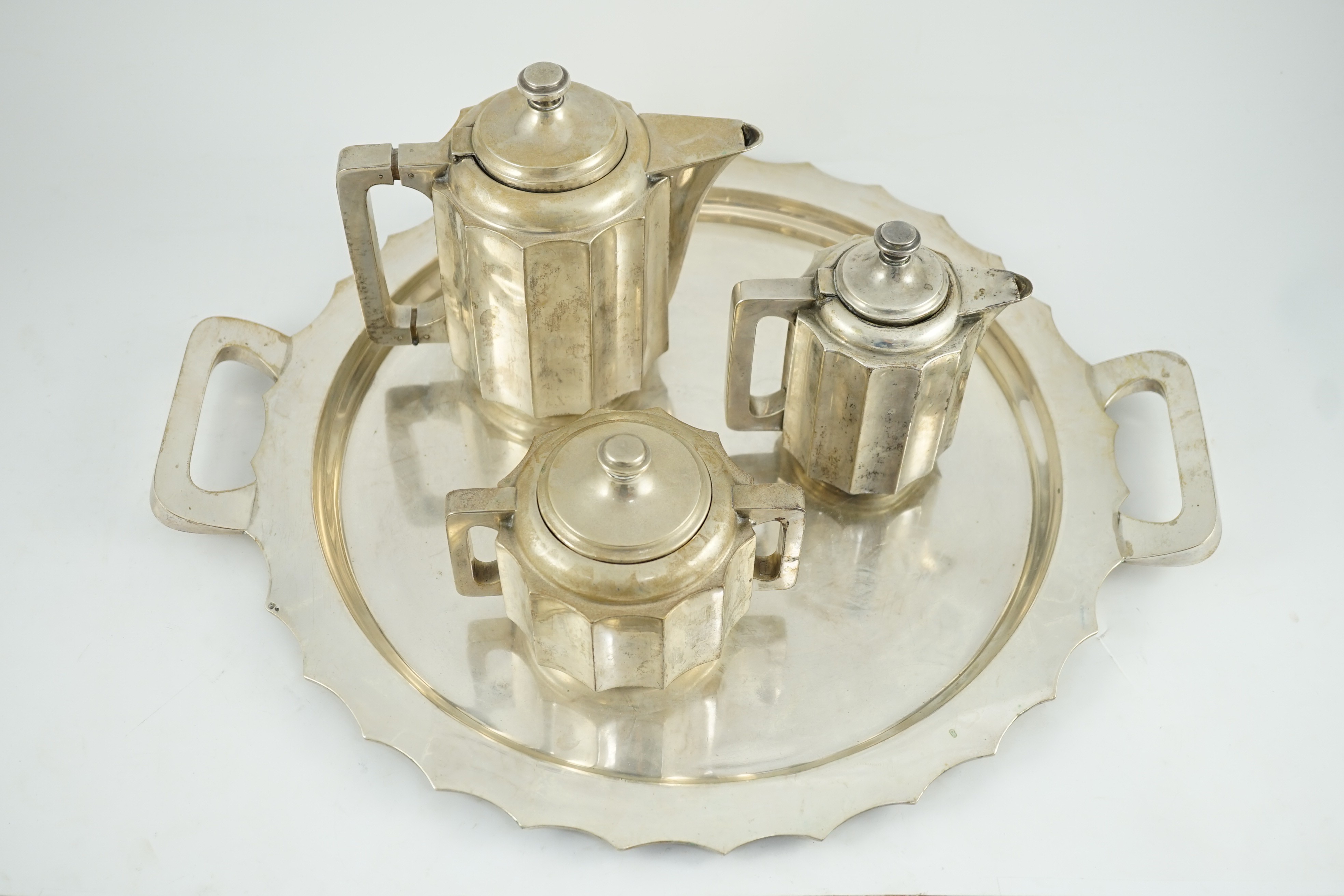 A 20th century Portuguese Art Deco three piece 833 standard silver tea set with two handled tea tray
